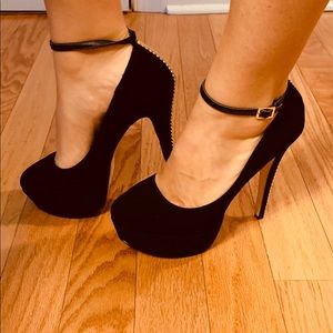 Black and gold platform stiletto heels.